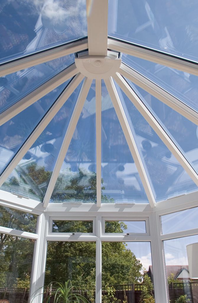 Victorian conservatory with a glass roof interior view